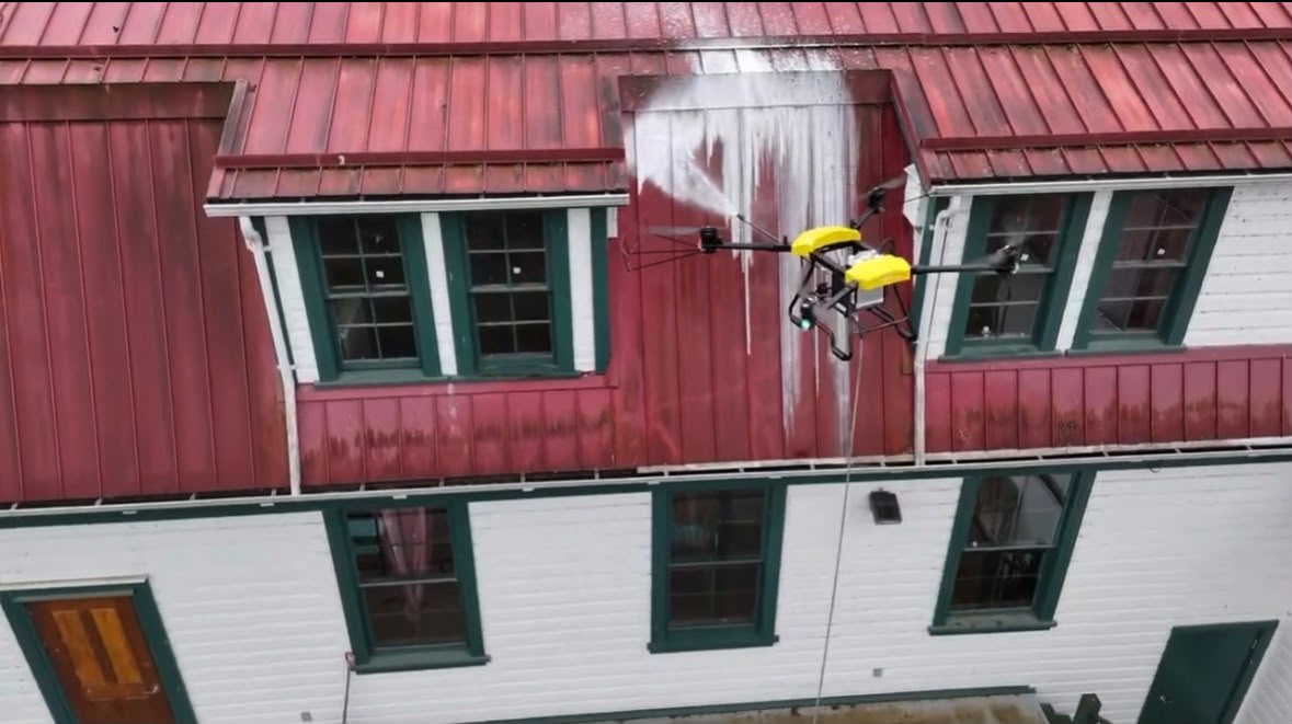 Drone cleaning a rooftop