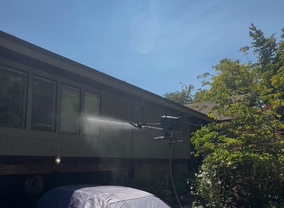 Drone washing high-rise office windows