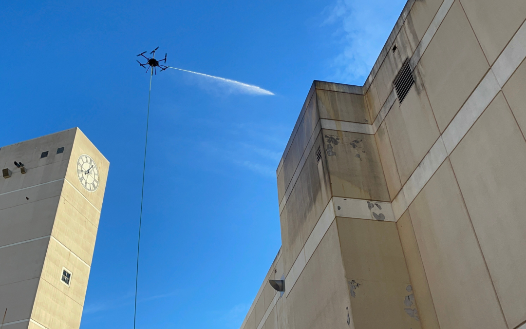 Drone cleaning a building facade
